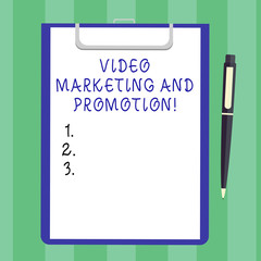 Handwriting text Video Marketing And Promotion. Concept meaning New modern ways for advertising campaign Blank Sheet of Bond Paper on Clipboard with Click Ballpoint Pen Text Space