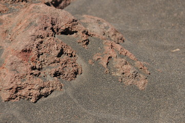 Irazu volcano in Costa Rica. Crater in clouds with protective barriers. Fragments of lava and pumice.