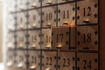 Wooden Advent calendar with little drawers with numbers