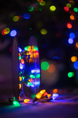Roll of Christmas Lights with Christmas tree  in Backgroun - Blurred Bokeh Lights Effect