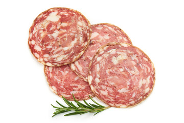 Salami Sliced. Thin Smoked sausage slices with herbs, isolated on a white background. Top view