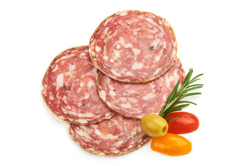 Thin Hungarian Salami Slices with herbs, isolated on a white background. Top view