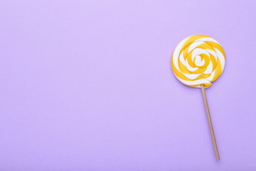 Colorful lollipop on purple background