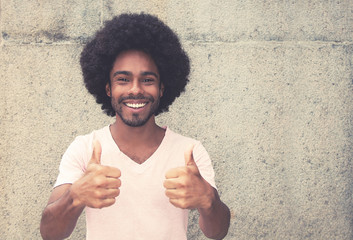 Successful african american hipster man showing thumbs up