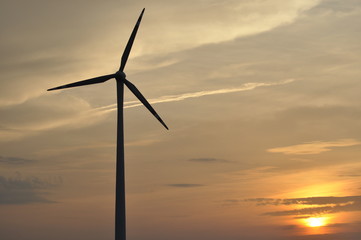 Windmill, production of green energy. Masts with blades