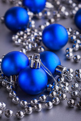 Christmas composition of Christmas tree toys on a blurred silver background