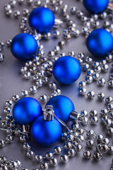 Christmas composition of Christmas tree toys on a blurred silver background