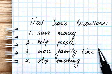 New year resolution in notepad with pen
