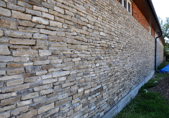 The wall is made of natural stone