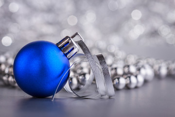 Christmas composition of Christmas tree toys on a blurred silver background