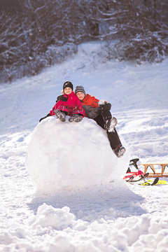 Kids enjoying snow on vacation