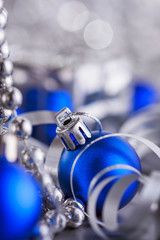 Christmas composition of Christmas tree toys on a blurred silver background