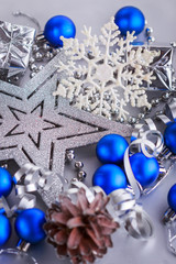 Christmas composition of Christmas tree toys on a blurred silver background