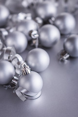 Christmas composition of Christmas tree toys on a blurred silver background