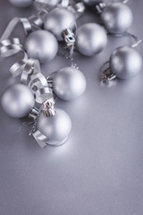 Christmas composition of Christmas tree toys on a blurred silver background