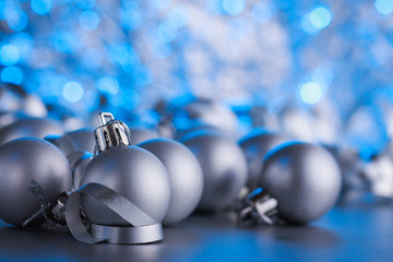 Christmas composition of Christmas tree toys on a blurred silver background