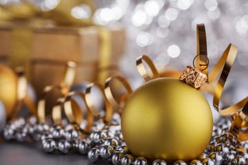 Christmas composition of Christmas tree toys on a blurred silver background