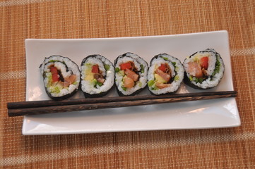 Sushi. Delicious meal with fish, rice and supplements, prepared at home.
