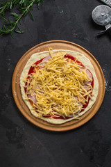 pizza, dough, ingredients, pepperoni, cheese, toatny sauce (cooking process). Top view with copy space