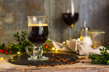 coffee in a transparent mug (with milk and spices). Top view. copy space