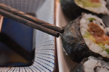 Sushi. Delicious meal with fish, rice and supplements, prepared at home.