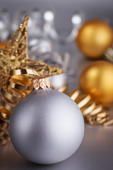 Christmas composition of Christmas tree toys on a blurred silver background