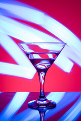 alcoholic glass in the club entourage, copy space, red background