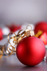 Christmas composition of Christmas tree toys on a blurred silver background