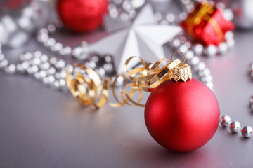 Christmas composition of Christmas tree toys on a blurred silver background