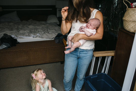 Toddler Crying To Stressed Out Young Mom