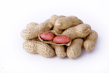 Peanuts in peel on a white isolate.