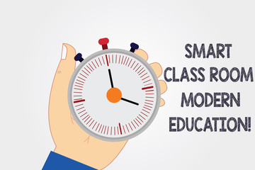 Naklejka premium Handwriting text writing Smart Class Room Modern Education. Concept meaning New technologies for school and learning Hu analysis Hand Holding Mechanical Stop Watch Timer with Start Stop Button