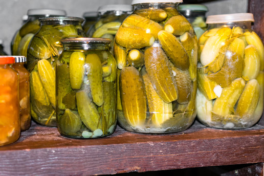 Glass Jar With Pickled Cucumbers In Grandma Basement