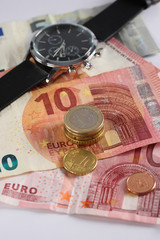 Money, Euro bills with wristwatches.