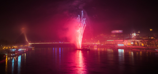 Naklejka na ściany i meble New Year Celebration. Fireworks on Danube River in Bratisalva, Slovakia