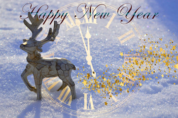 A beautiful wooden Christmas deer is standing in the snow with the inscription HAPPY NEW YEAR.