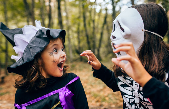 Two little girls disguised in Halloween