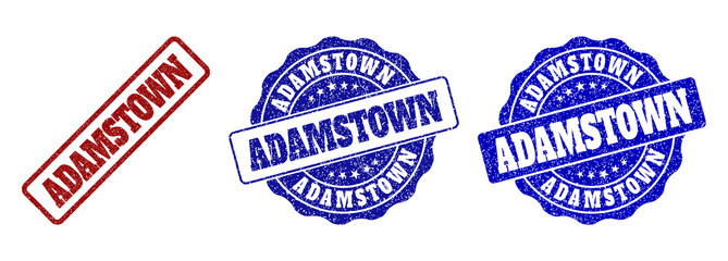 ADAMSTOWN scratched stamp seals in red and blue colors. Vector ADAMSTOWN labels with distress style. Graphic elements are rounded rectangles, rosettes, circles and text titles.