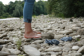 woman standing on stones
