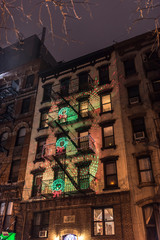Christmas light reef decorations on fire escapes in New york City