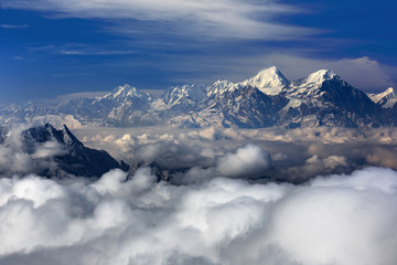 Minya Konka (Mount Gongga) view from Niubeishan Cattle Back Mountain in Sichuan Province, China. Summit shrouded in clouds. Highest Mountain in Sichuan Province China. Hard Rime, deep snow, frost