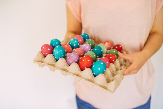 woman hold easter eggs