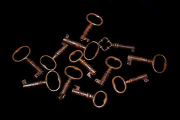 Bunch of Vintage Antique Risty Keys on Black Background