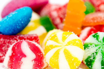 Mixed colorful candies isolated on white background. Close up.