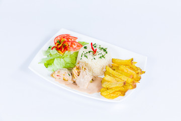 South American cuisine: rice with french fries, meat with cottage cheese and vegetable salad