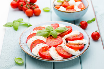 Classic caprese salad. Mozzarella tomatoes and  Basilikum.