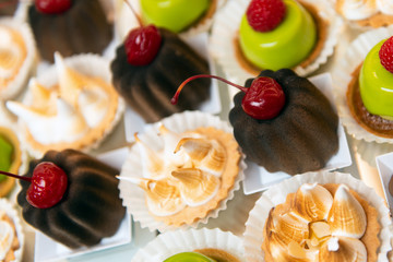 Different beautiful appetizing desserts on event. Handmade catering service.