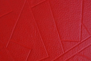 Fototapeta premium red paper texture of a piece of cardboard with a pattern