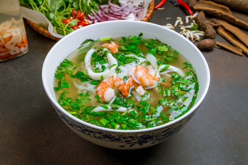 Vietnamese soup Pho with shrimp and squid