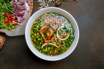 Vietnamese soup Pho with shrimp and squid